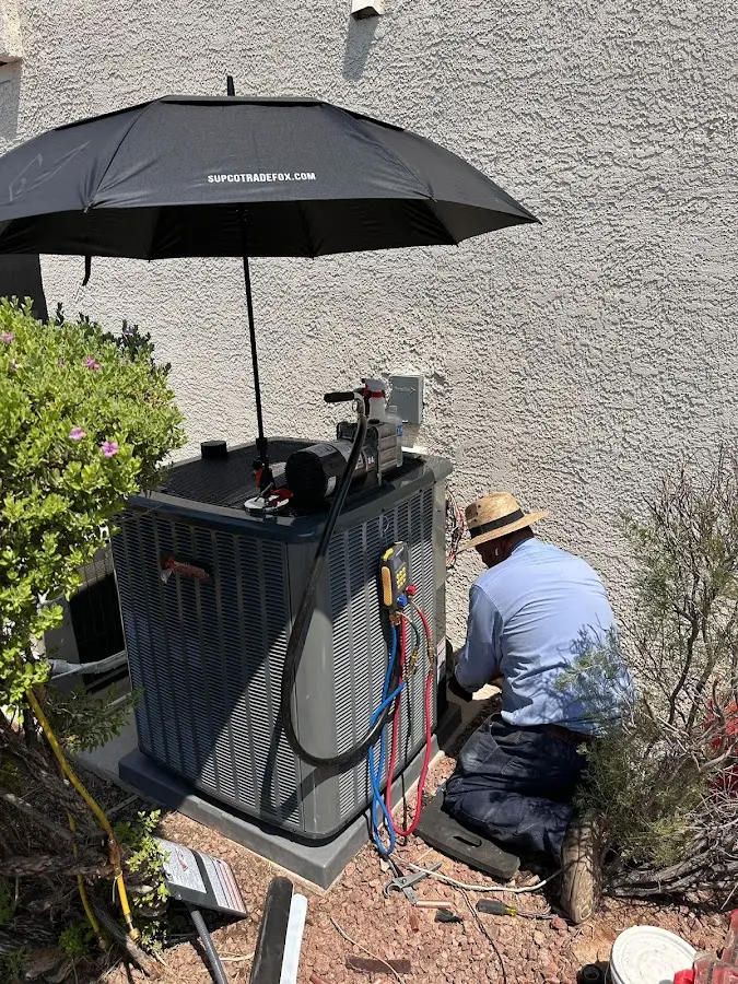 HVAC technician performing outdoor AC maintenance in Lower Swatara